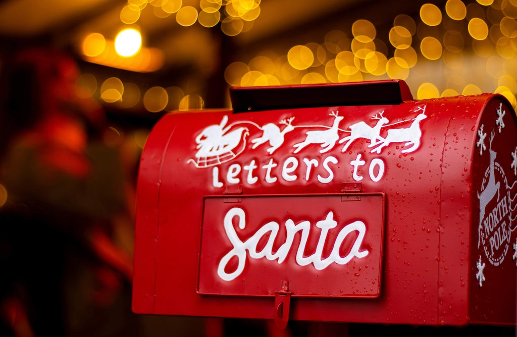 red metal mail box with "letters to Santa" written on the side