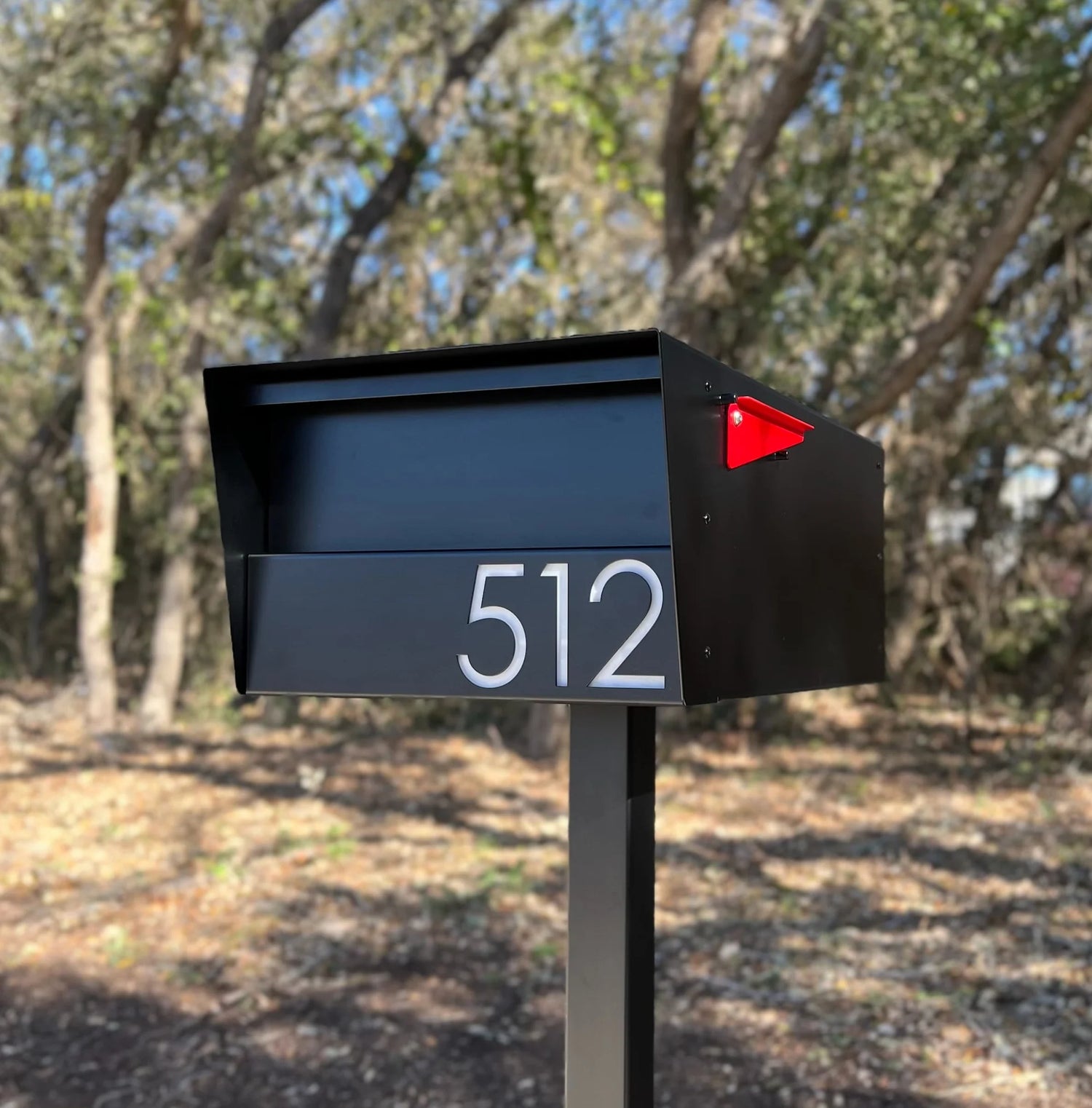 black dexter mailbox with red flag